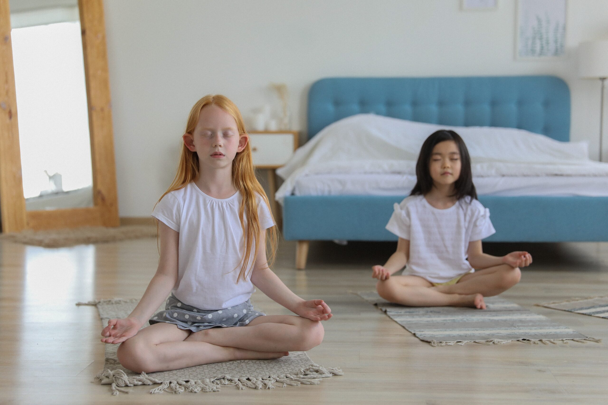 two girls meditating
