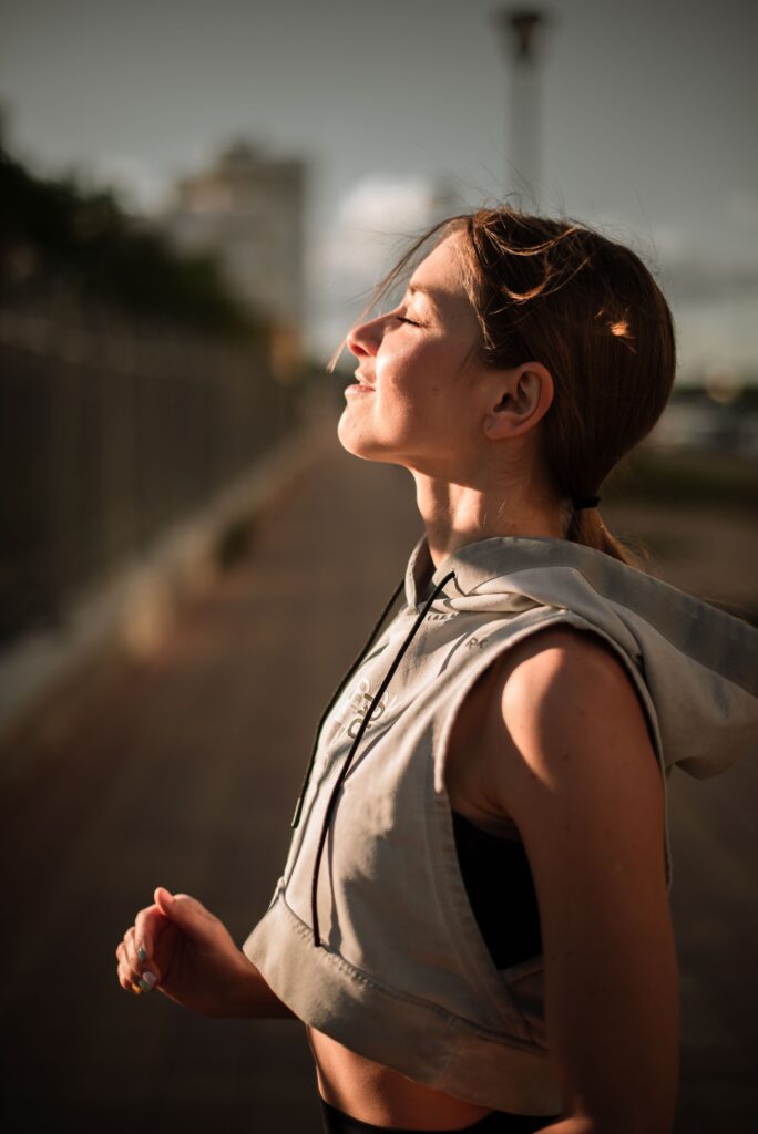 woman taking a deep breath