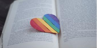 LGBTQ heart on book